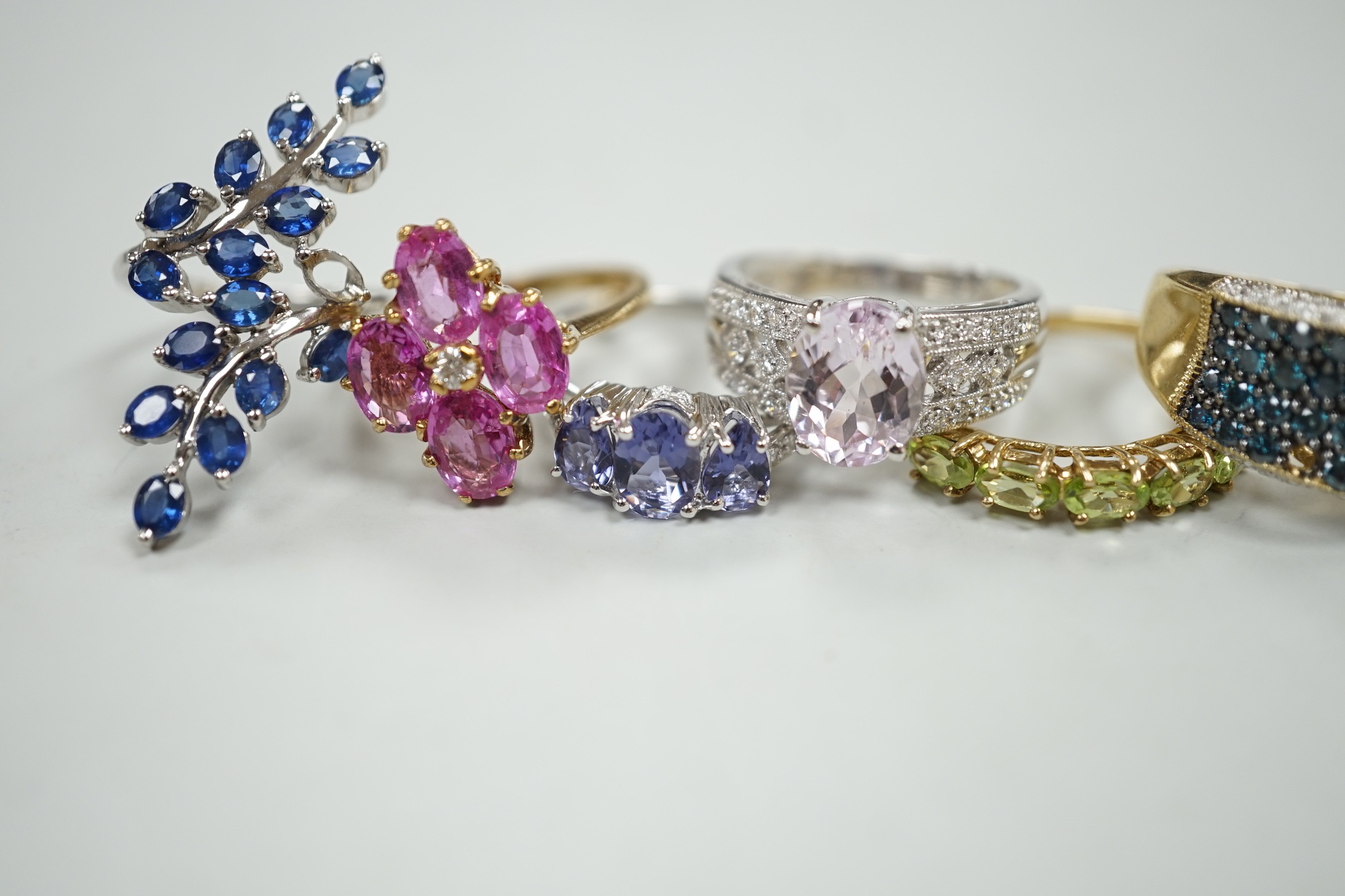 Six assorted modern 9ct gold and gem set dress rings, including three white gold, gross weight 20 grams.